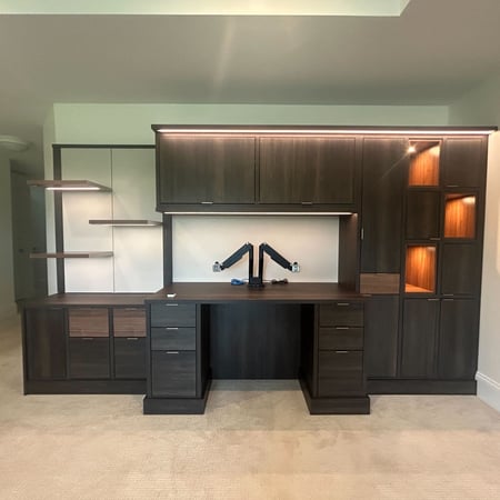Custom home office desk with a dark brown countertop. With shelving and Drawers