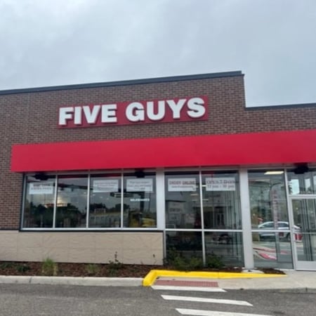 Exterior photograph of the Five Guys restaurant at 600 Cypress Gardens Boulevard in Winter Haven, Florida.