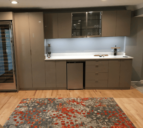 Custom bar with cabinets, drawers, shelving, and a countertop.