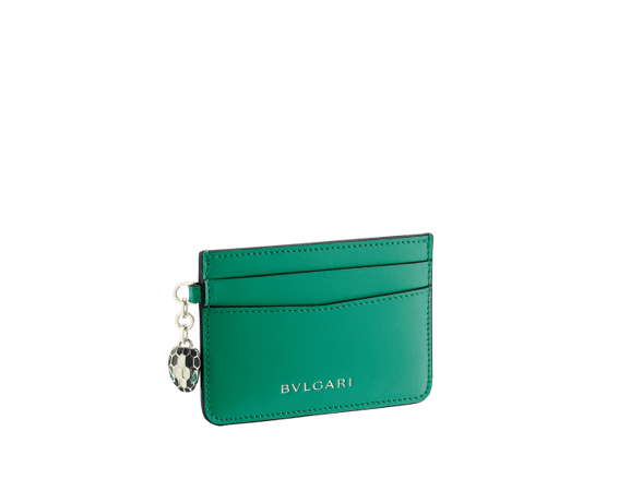 Serpenti Forever card holder in emerald green calf leather. Iconic snakehead charm in black and white agate enamel, with green emerald enamel eyes.