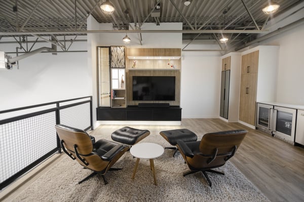 Custom condo garage system, media center, and wall bed by California Closets Edmonton, Alberta.