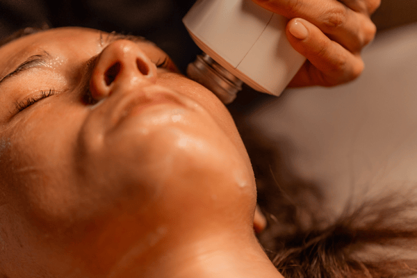 Woman receiving Glacial Skin Cryo Facial Treatment