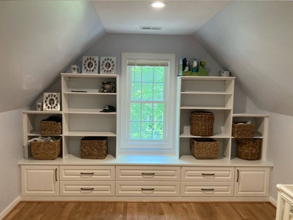 Richmond - Custom closets - Built-in bookshelves on the wall with a sloped ceiling