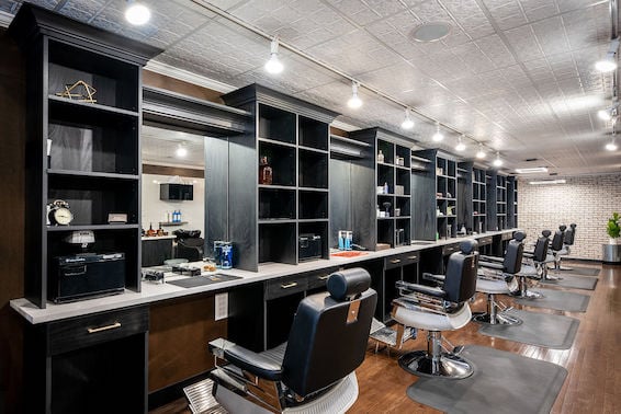 Grooming parlor with custom, black work stations.