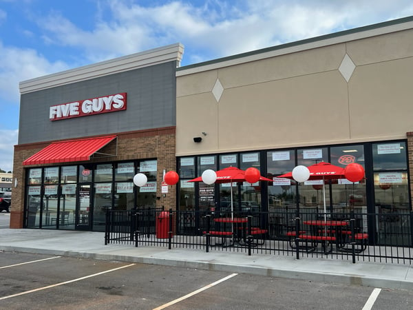 Exterior photograph of the Five Guys restaurant at 800 Pavillon Parkway  Suite P2-A in Monroe, Georgia.