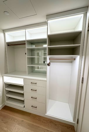 Img 3 - California Closets New York Designer Lea Nardi White Walk-in Closet with LED lighting, hanging, shelving, mirrored backing, drawers and open pull-out shelving