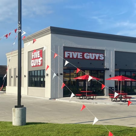 Exterior photograph of the Five Guys restaurant at 625 West Highway 30 in Gonzales, Louisiana.