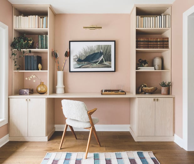 California Closets Austin custom home office setup, featuring floor-to-ceiling storage with adjustable shelving, and ample file drawers for a personalized, organized workspace with a serene neutral palette.
