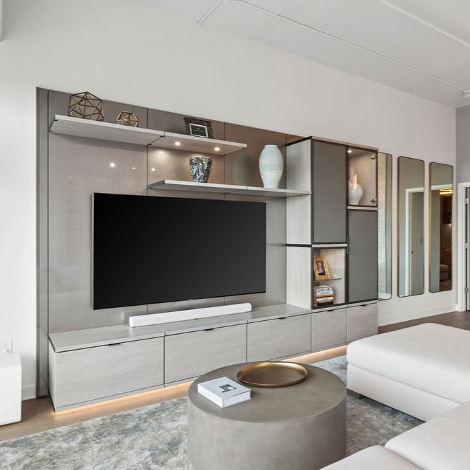 Custom Build Media Center with lighting and floating shelves by California Closets Greater Detroit, Michigan.