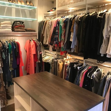 Greensboro - Custom closets - walk-in closet with hanging rods, illuminated shelves, and a central island with a wood countertop