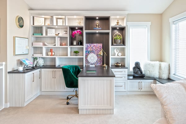 Home office with an abundance of bookshelves and storage by California Closets Edmonton, Alberta.