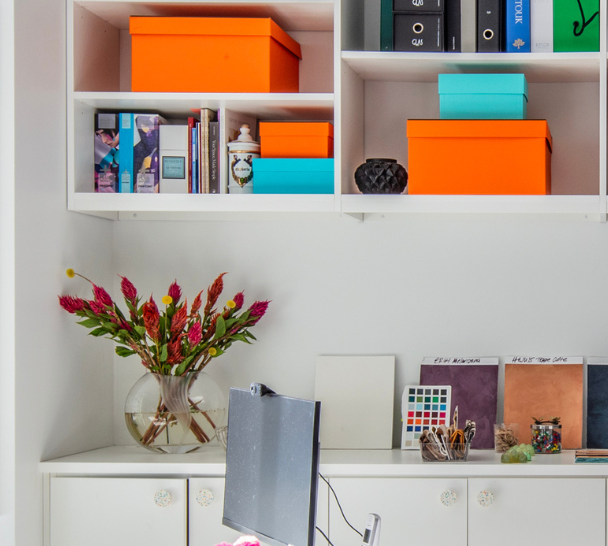 California Closets New York City Custom Commercial Space White Office Custom Bookshelves Storage Interior Design Studio with Closed Cabinets and two desk workspaces