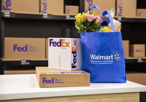 FedEx boxes on a counter along with a Walmart bag filled with groceries