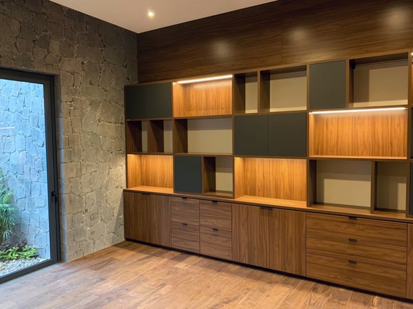 Wall unit with drawers, cupboards and display shelving with built in lighting