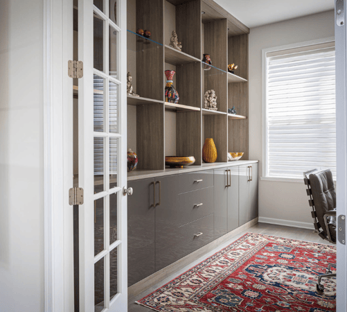Img 1 California Closets Hudson Valley New York Gray and White Home Office Custom Wall Unit Custom Home Office with High Gloss Gray Drawers, Glass Shelves, Closet Lighting, and Bookshelves