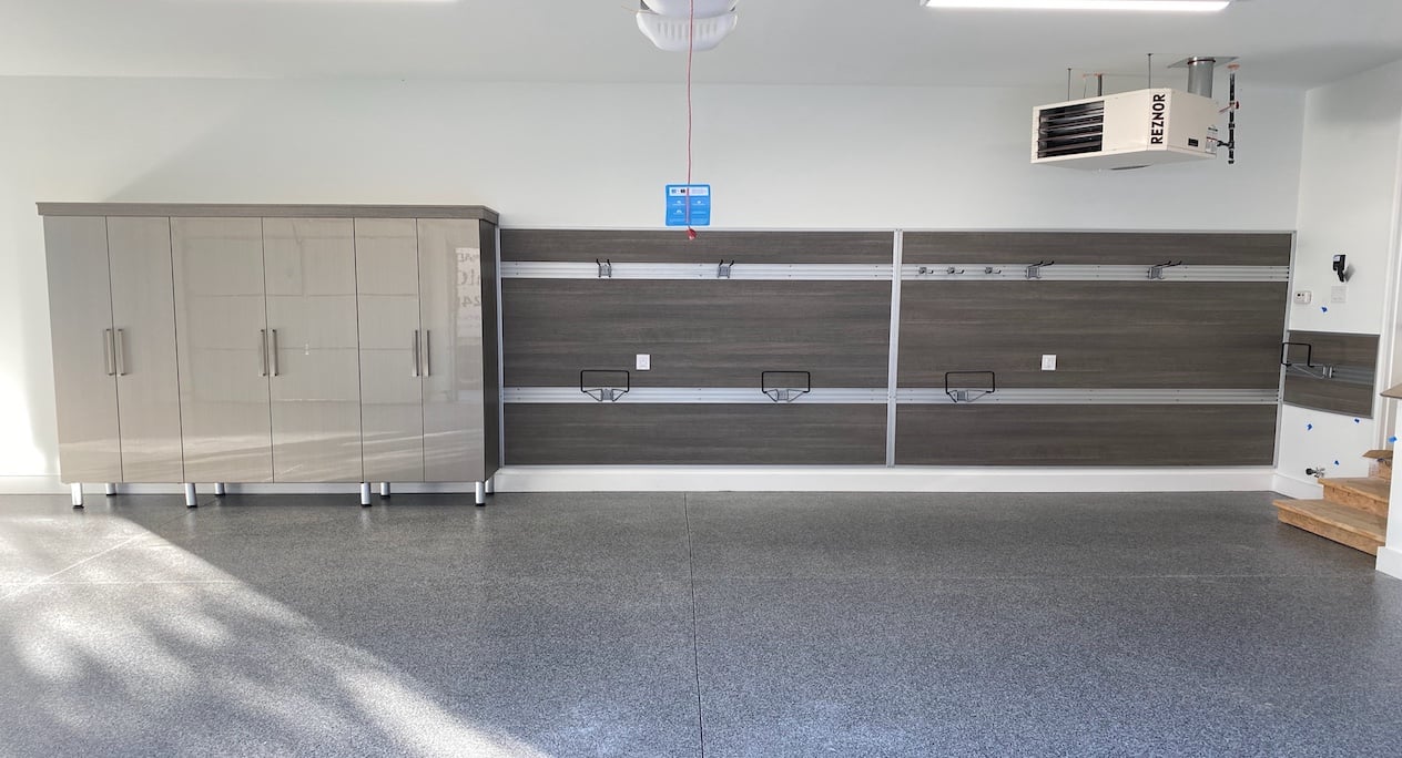 Garage storage with cabinets, drawers,, and tool rack by California Closets Michigan