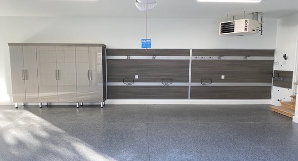 Garage storage with cabinets, drawers,, and tool rack by California Closets Michigan