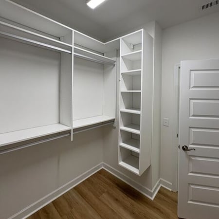 Greensboro - Custom closets - white walk-in closet with racks for clothing and shelves