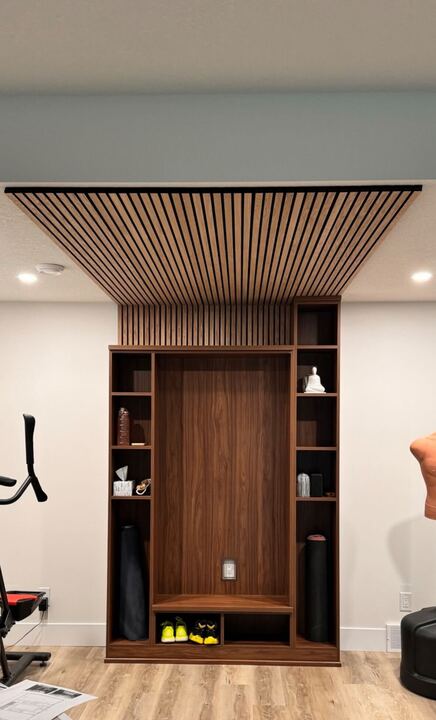 Open shelving in a reddish brown finish creates the perfect space to store your at home gym equipment.