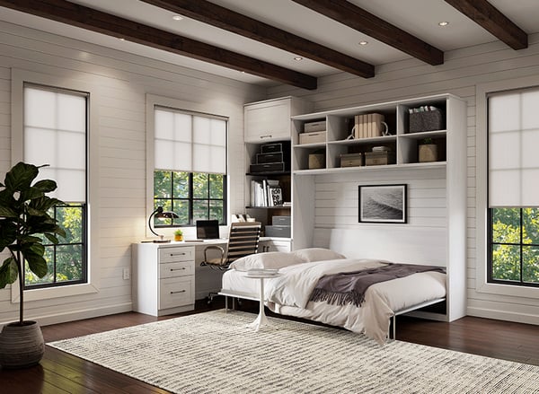 Home office with white wall bed and brown accents | California Closets