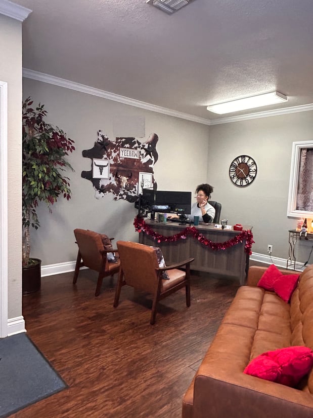 Our front lobby — and your first friendly face when you walk in! Cyn Silguero is here to help you manage and review your account with care. 💙
