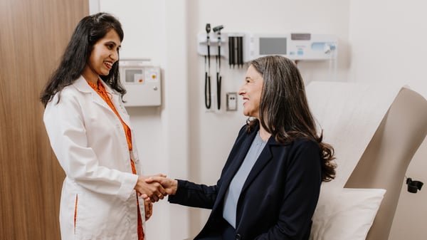 Doctor greeting female patient