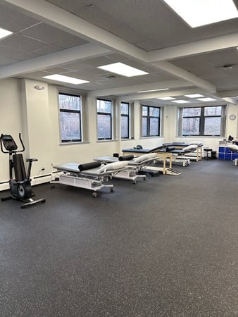 Inside Bay State Physical Therapy clinic showing Patient room with tables in Belmont, MA.