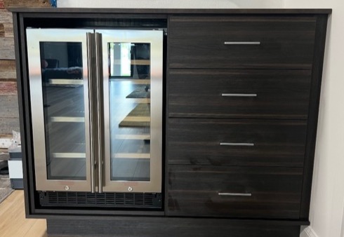 Office mini bar storage with Cappuccino finish, Maya Bronze countertop, and matte aluminum hardware.
