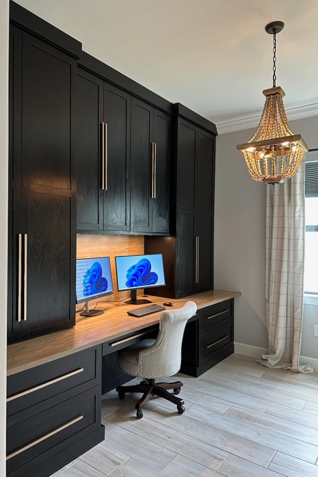 Custom office in Shadow Black and Capri finishes with matte gold hardware, featuring a black in-surface power station and recessed square puck lighting.