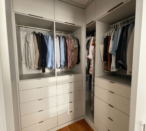Img 6 California Closets Orange County New York Functional Walk-in Closet with Short Hanging for Shirts and Pants and Drawers Underneath in Beige with Gold Drawer Handles
