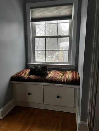 window nook with 2 storage cabinets on bottom