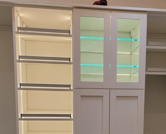 White shelving with custom lighting
