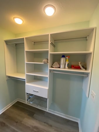 Perfect wall system with shelves and hanging.
