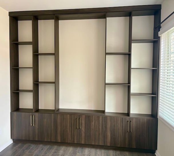 Built-in bookshelves and shelving with cabinets for living room storage solutions and home organization in Grand Blanc, Michigan