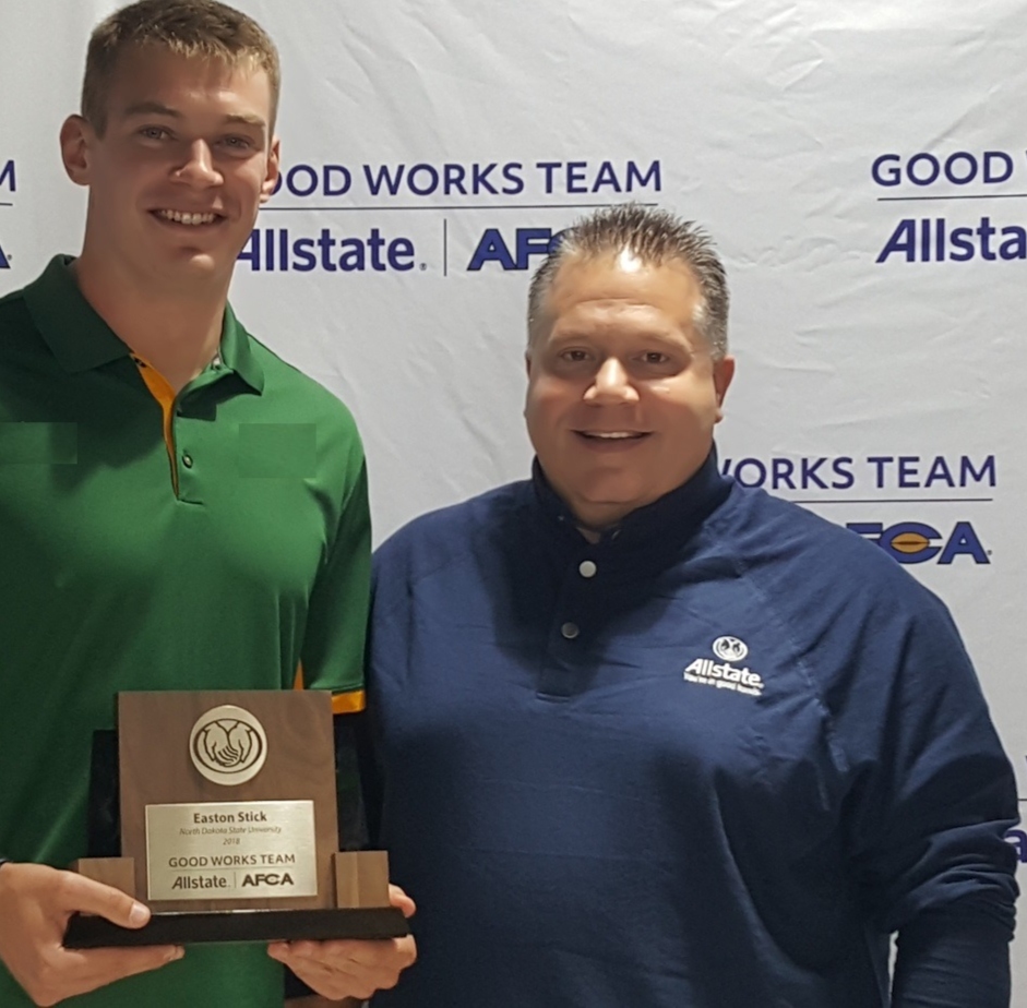 Fred presenting the Allstate AFCA Good Works Team award to Easton Stick of NDSU Bison Football.