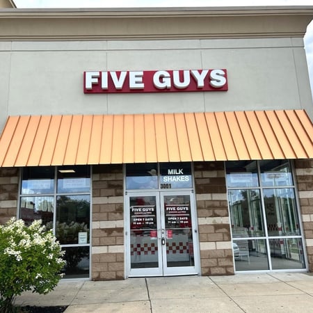 Exterior photograph of the entrance to the Five Guys restaurant at 1000 Easton Road in Wyncote, Pennsylvania.