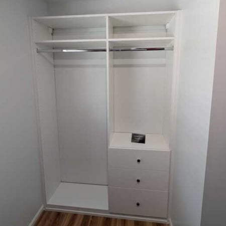 Virginia Beach - Custom closets - Reach-in closet with dual hanging rods and drawer tower on wood flooring.