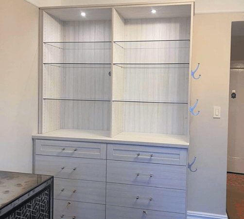 California Closets Long Island City NY built in closets custom wardrobe unit glass shelving closet lighting storage ideas for closets closet drawer organizer closet organization custom cabinets luxury