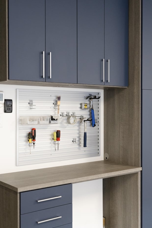 Custom garage cabinets and garage slatwall accessories by California Closets Edmonton, Alberta.