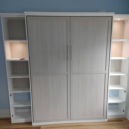 Wall bed design with shelves complete with lighting.