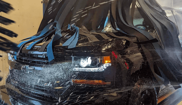 Large SUV being washed by Conserve Car Wash Automatic Cloth Wash in North Conway, NH