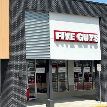 Exterior photograph of the Five Guys restaurant at 200 West Ridge Pike in Conshohocken, Pennsylvania.