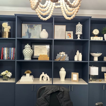 This is a Deep Pond finish dark blue system with a Misty Orchard finish bottom shelf.