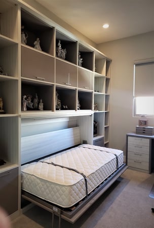Murphy bed with desk, shelves, and cabinets