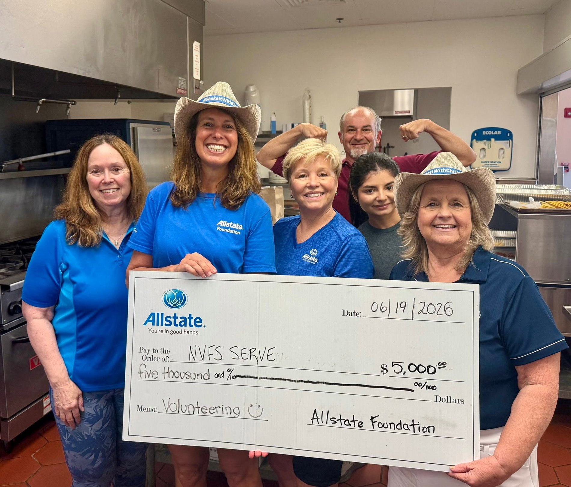 Local Gainesville, VA Allstate Insurance Agent, Christine Angles, volunteering with her team at the NVFS Serve shelter. The Allstate Foundation showed their support of their volunteer efforts and gave them a $5,000 Helping Hands Grant.