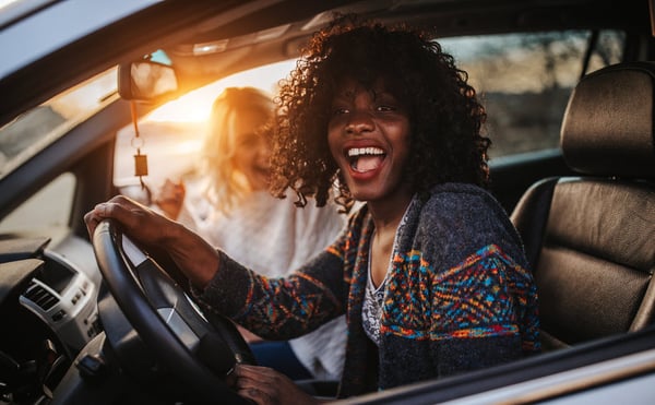 woman-driving-sunset
