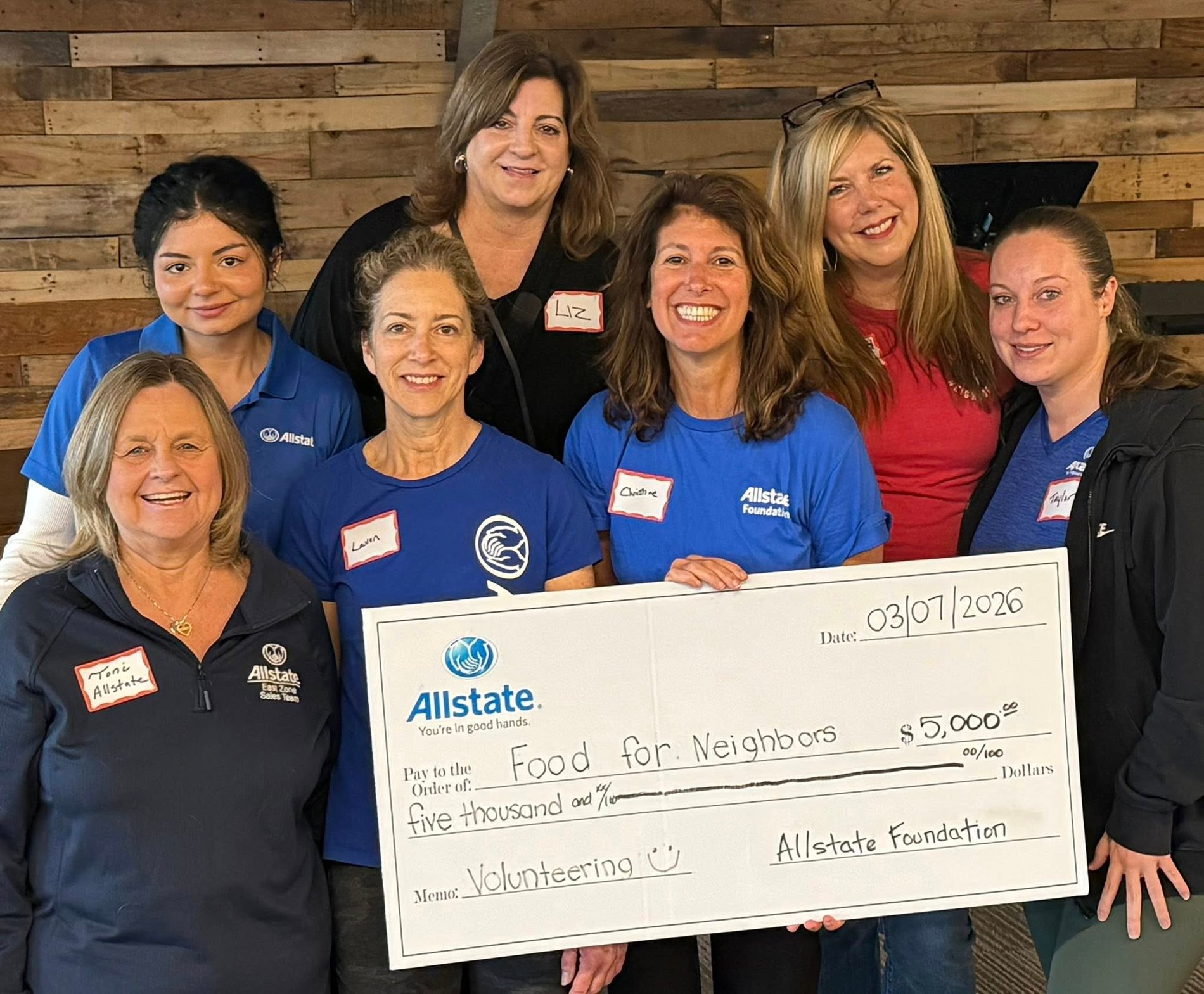 Northern Virginia Allstate Home Insurance Agent, Christine Angles, volunteering with her team at the Food for Neighbors nonprofit. The Allstate Foundation supports them in empowering their local community and gave them a $5,000 Allstate Foundation Helping Hands Grant.
