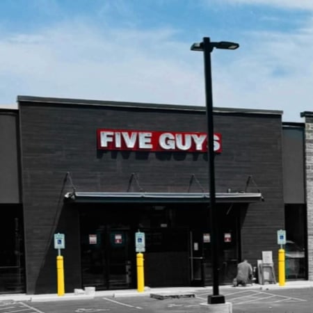 Exterior photograph of the Five Guys restaurant in Grafton, Wisconsin.