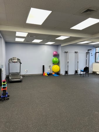 Inside Bay State Physical Therapy clinic showing Patient room with PT equipment in Belmont, MA.