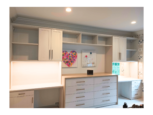 Light wood finish kids dresser with vanity on right and desk on left and upper cabinets and shelving